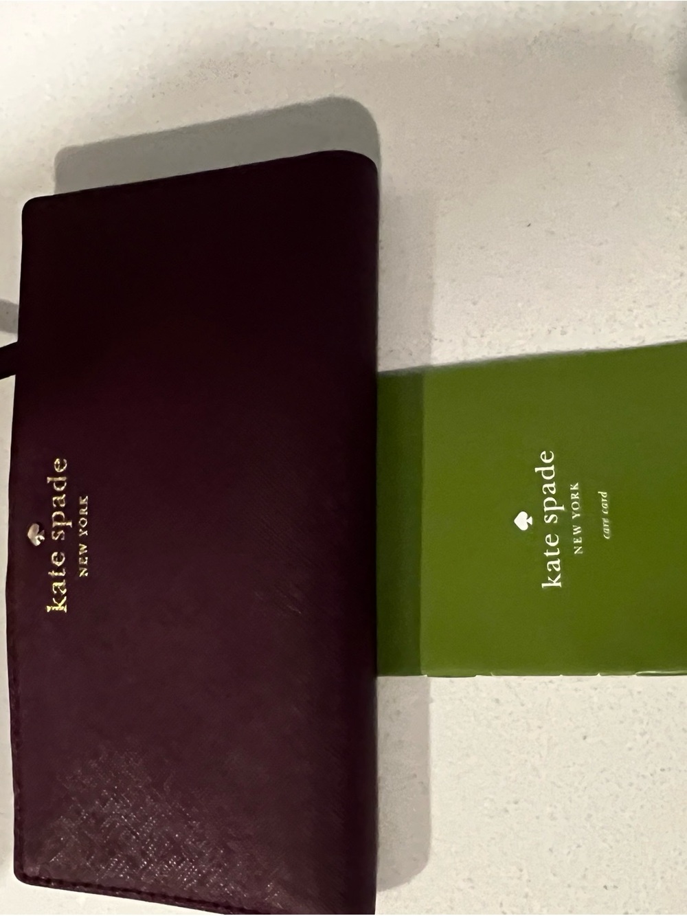 kate spade Burgundy Leather Continental Wallet with Gold Logo
